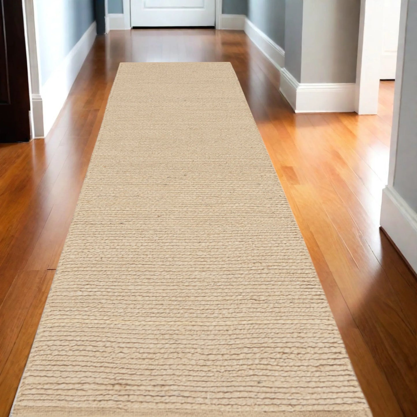 Beige jute runner rug on a wooden floor in a home setting