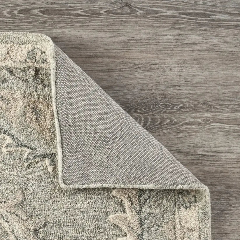 corner turned over on floral wool rug