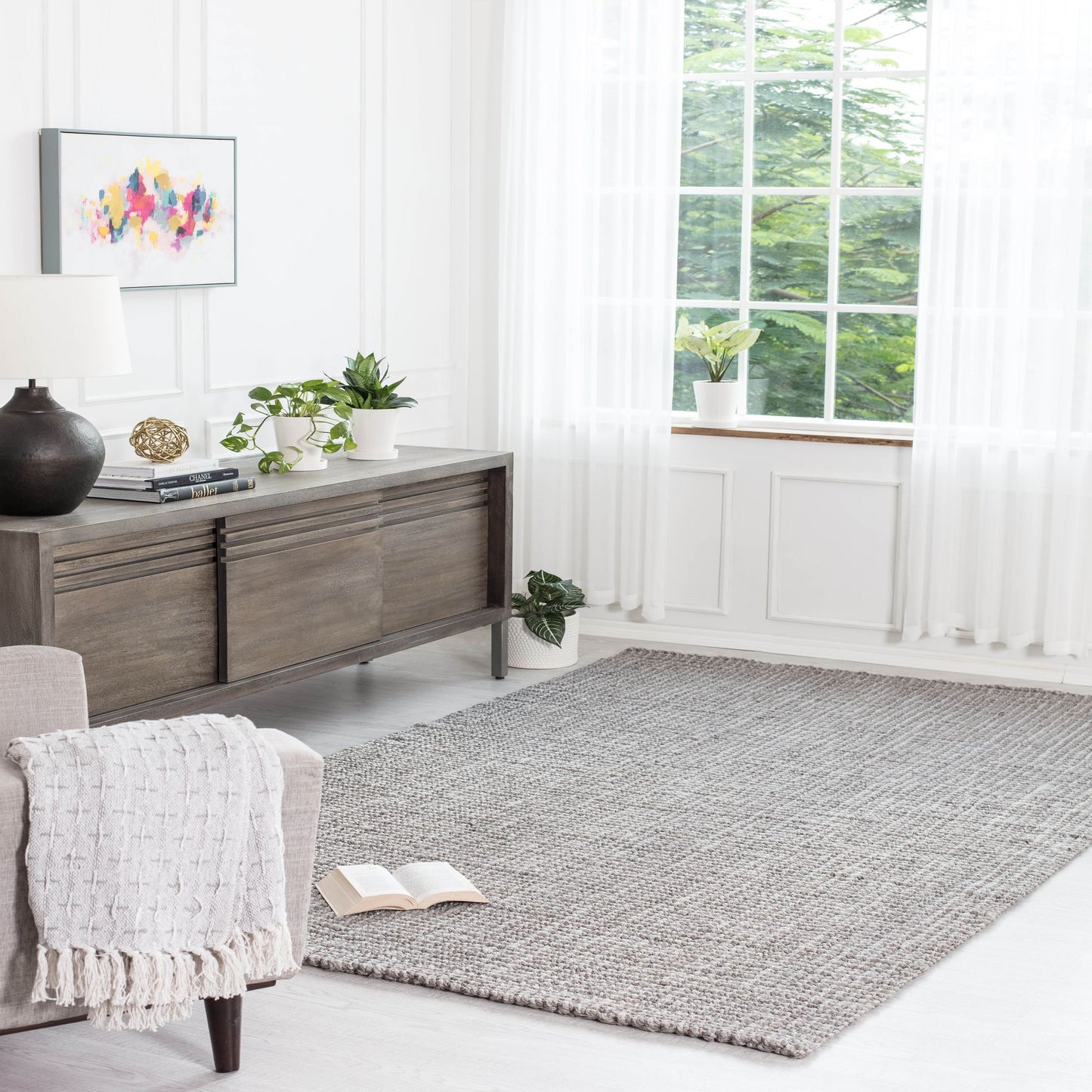 Gray Jute Area Rug in living room with credenza and wall art