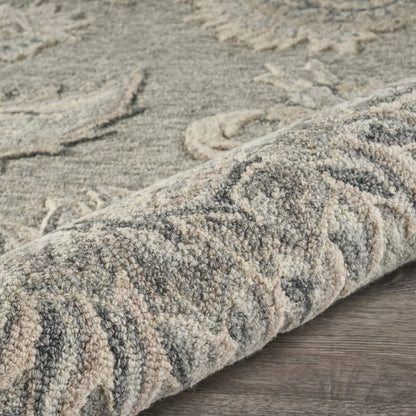 Textured wool rug with intricate patterns on a wooden floor