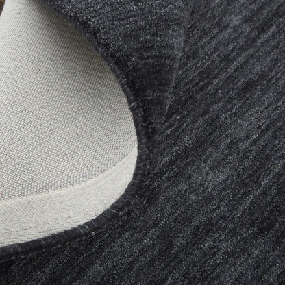 Close-up of a textured black wool rug