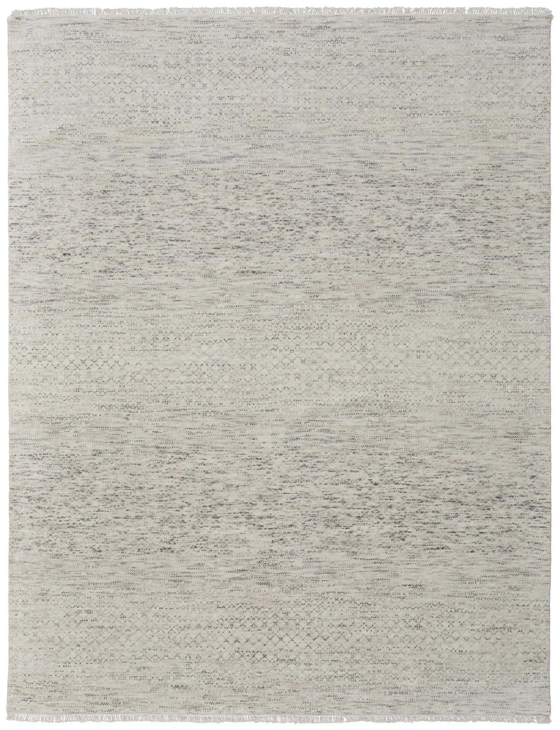 textured gray wool rug on white background