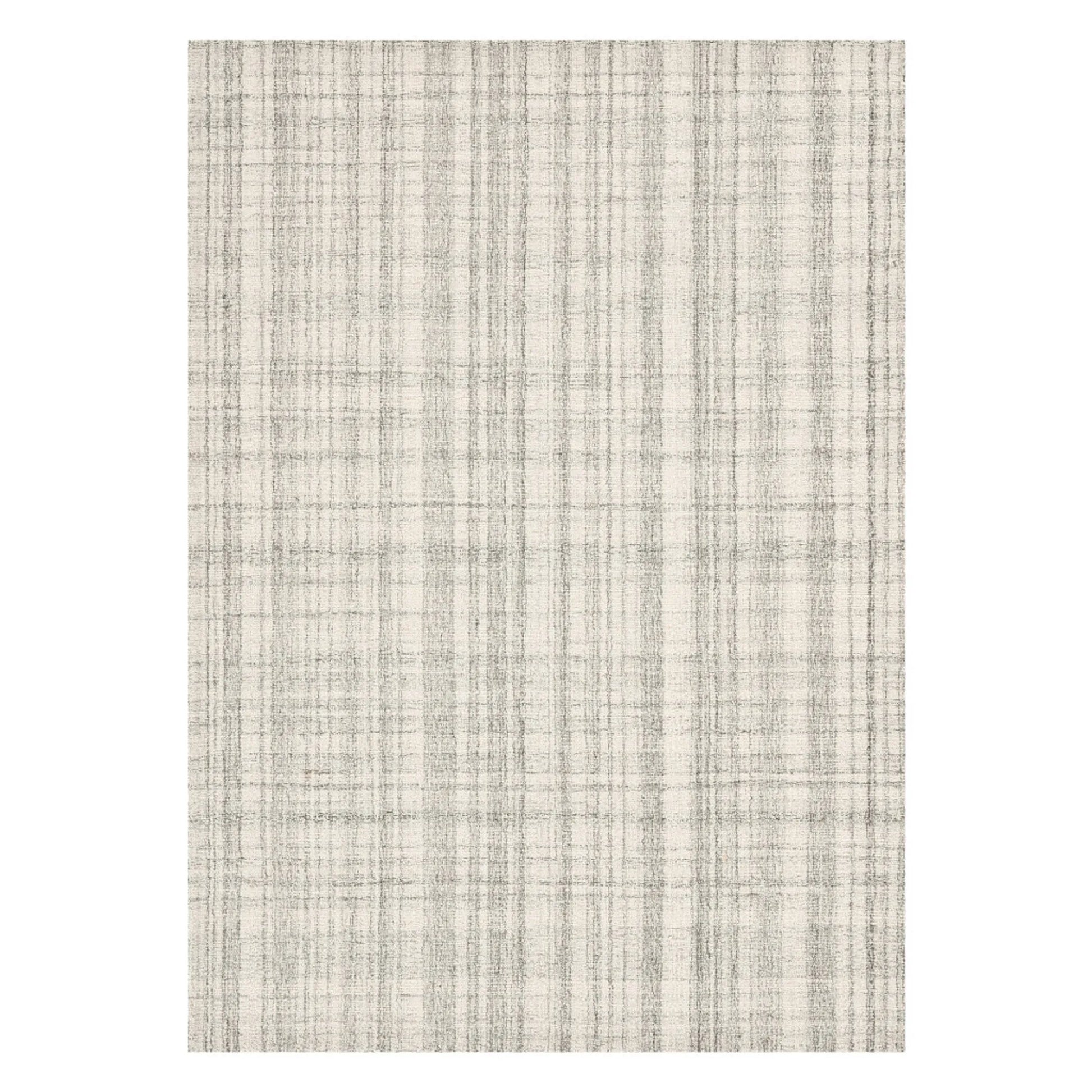 Textured wool rug with a neutral color palette on a white background