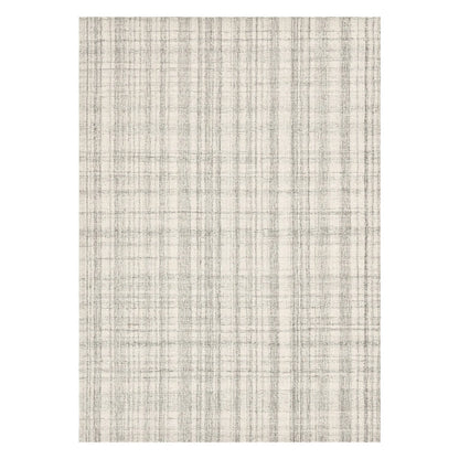 Textured wool rug with a neutral color palette on a white background