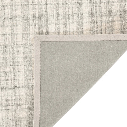 Textured wool  rug corner with a neutral color palette on a white background