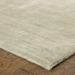 edge of ivory wool rug
