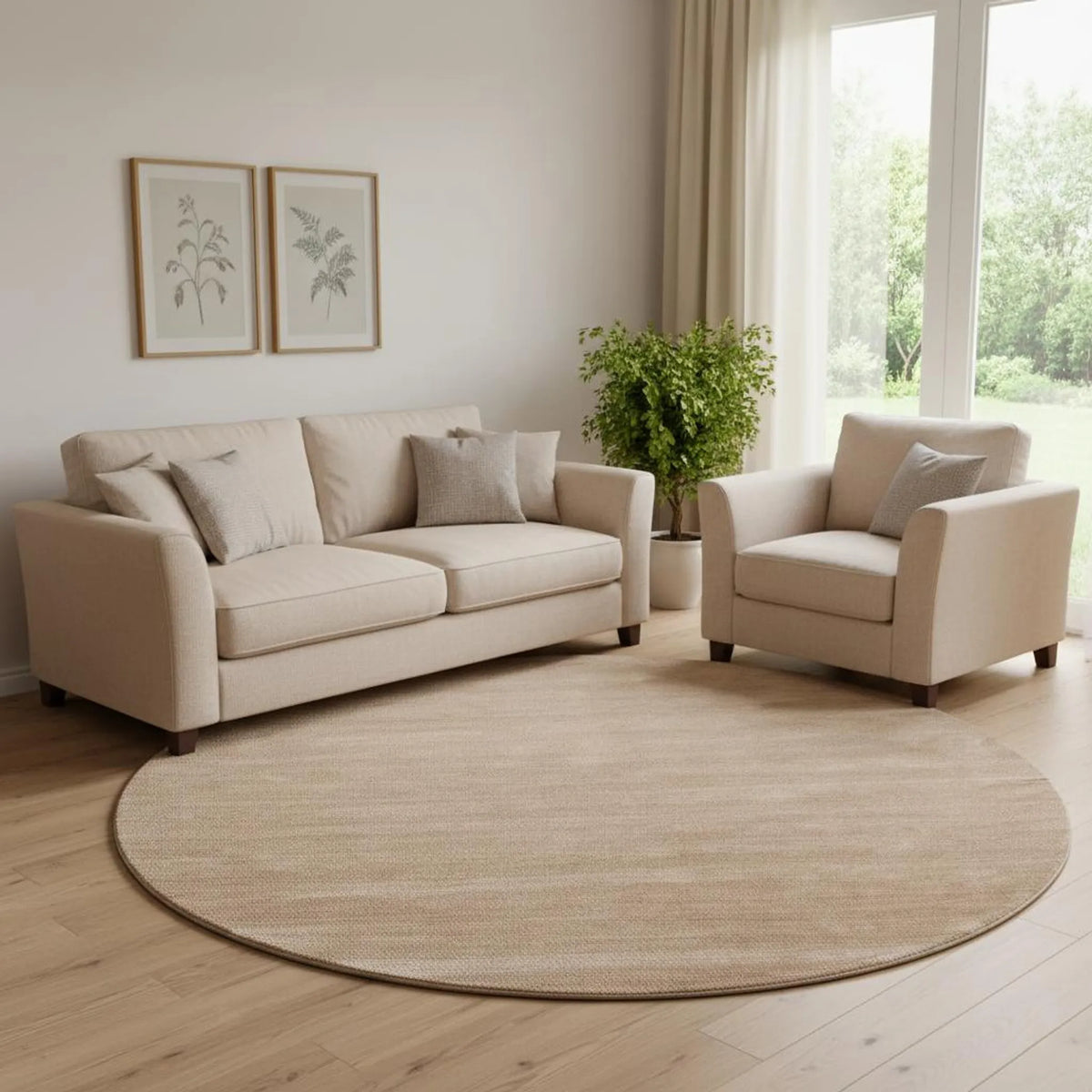 Beige sofa and armchair in a living room with a round beige rug.