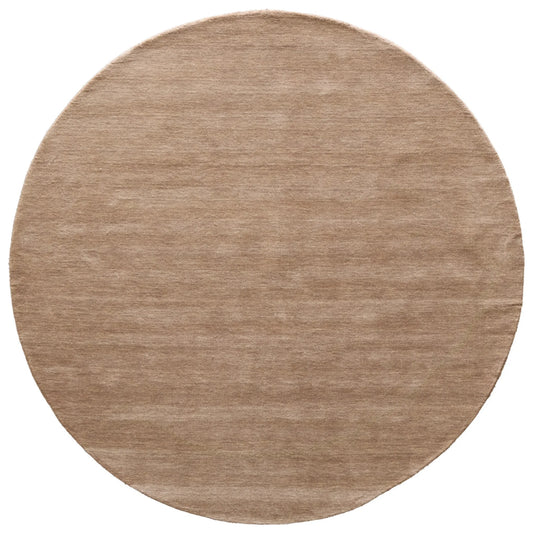 Round beige rug on a white background