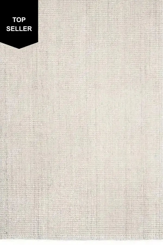 Textured ivory jute rug with a 'Top Seller' label in the corner.