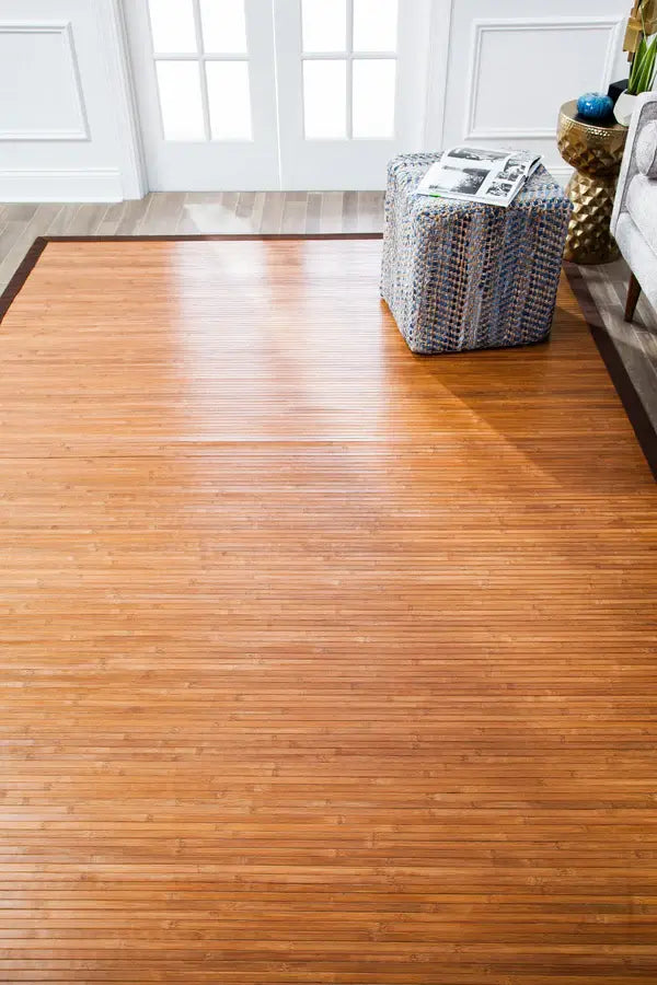 medium tone bamboo rug with a basket and decor items in a room.