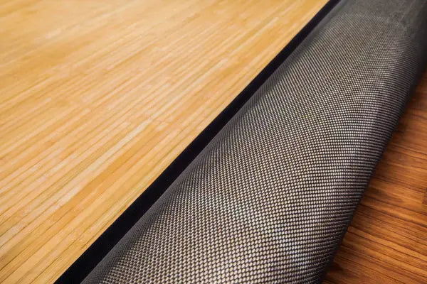 bamboo rug rolled back to reveal backing