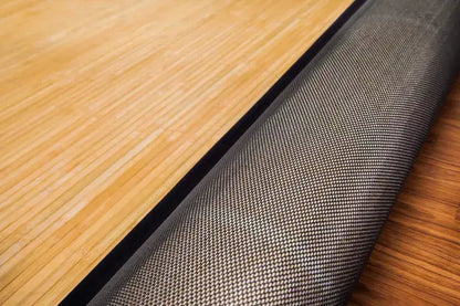 bamboo rug rolled back to reveal backing