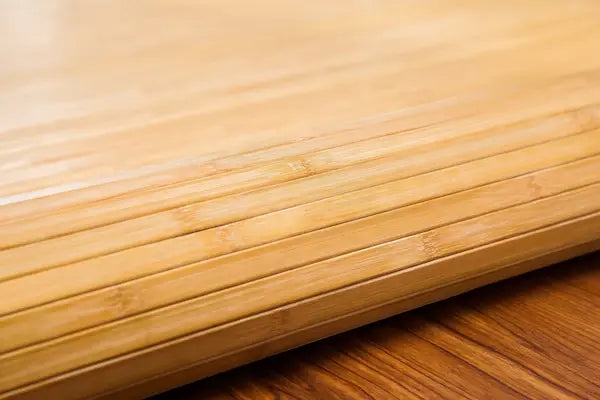 Close-up of a bamboo mat on a wooden floor
