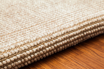 rolled up edge of textured woven rug