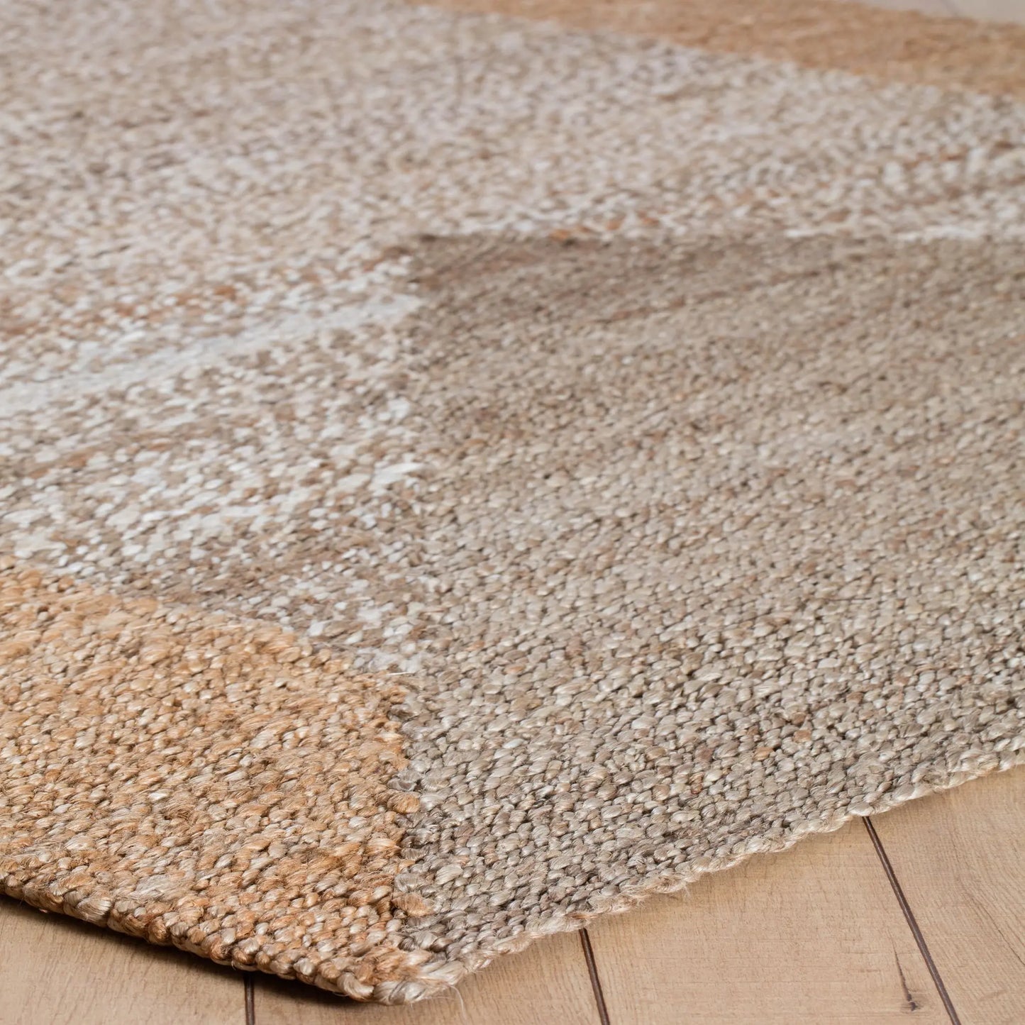 geometric pattern in a tan and tape woven rug