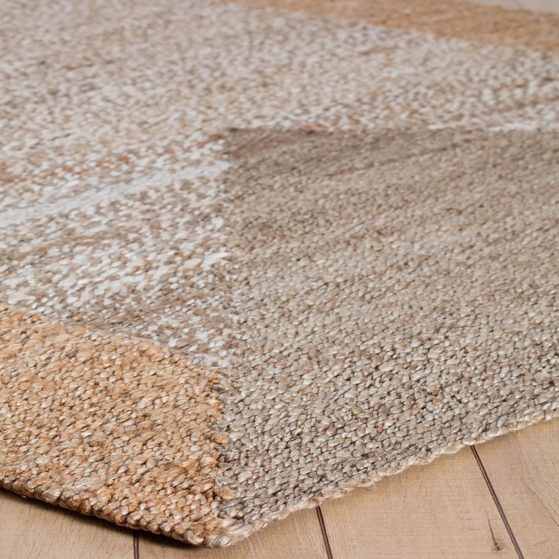 geometric pattern in a tan and tape woven rug