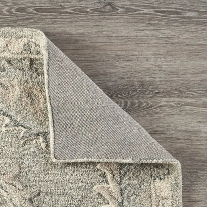 corner turned over on floral wool rug 