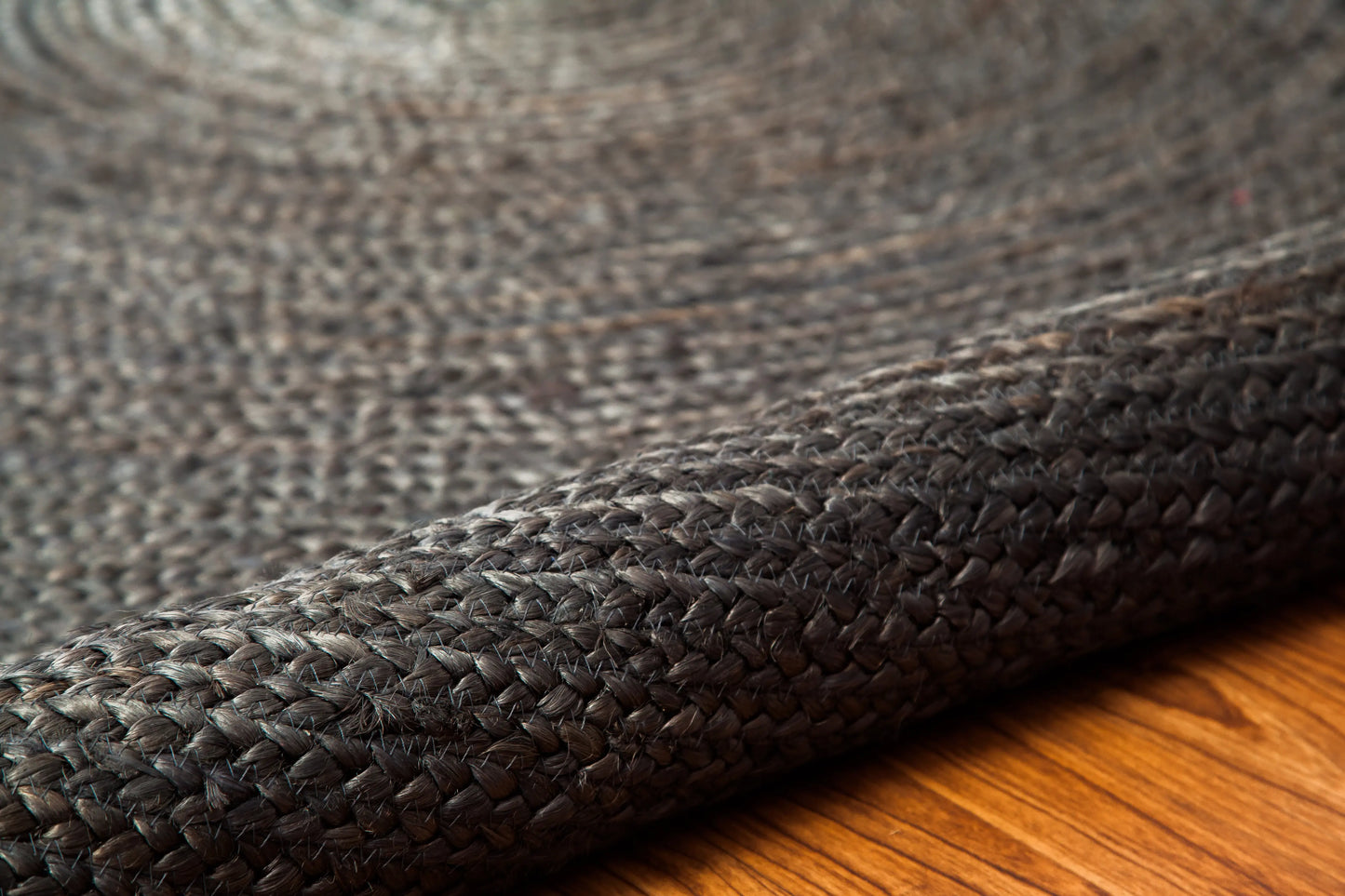 rolled back round gray jute rug