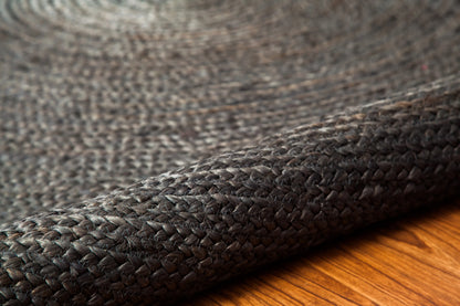 rolled back round gray jute rug