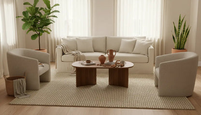 Modern living room with a sectional sofa, coffee table, and decorative items.