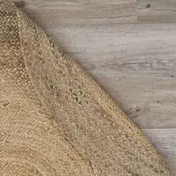 Textured brown fabric on a wooden surface