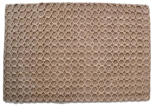 Textured beige jute rug with a diamond pattern on a white background