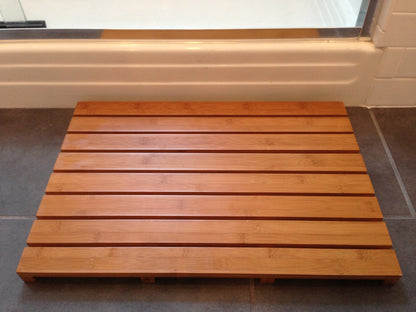 Moso Bamboo Bath and Sauna Mat outside of shower