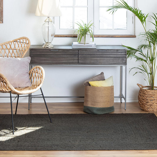 Dark Gray Jute Rug with wicker chair and credenza