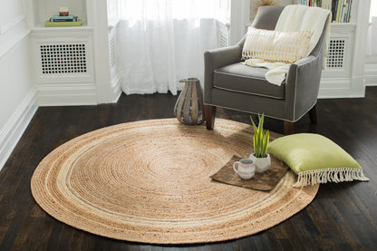  Round Braided Jute Rug with gray chair and modern decor