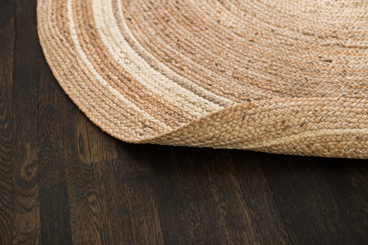 round jute rug with edge rolled back