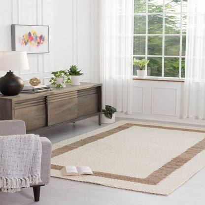 Whippoorwill Handloom Woven Jute Area Rug in a living room