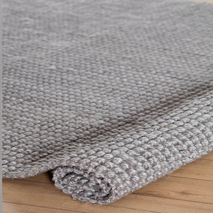 Andes Handloom Woven Gray Jute Area Rug rolled