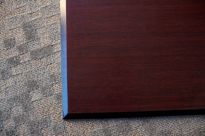 corner detail of cherry office chair mat on carpet